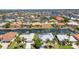 Beautiful waterfront homes with private docks on a sunny day, showcasing stunning coastal living at 2718 Saint Thomas Dr, Punta Gorda, FL 33950