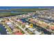 Stunning aerial view of waterfront homes with boat docks and lush landscaping in a desirable coastal community at 2718 Saint Thomas Dr, Punta Gorda, FL 33950