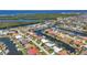 Beautiful waterfront neighborhood with canals, docks, and diverse home styles, set against a backdrop of lush greenery at 2718 Saint Thomas Dr, Punta Gorda, FL 33950
