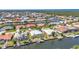 Waterfront community featuring scenic canals, lush greenery, and diverse home styles with easy access to the open water at 2718 Saint Thomas Dr, Punta Gorda, FL 33950