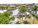 Lovely home with a metal roof, surrounded by trees and lush green landscaping at 2718 Saint Thomas Dr, Punta Gorda, FL 33950