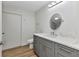 Bathroom with gray vanity, white countertop, and modern fixtures at 2718 Saint Thomas Dr, Punta Gorda, FL 33950