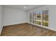 Bright bedroom with wood floors and large windows with plantation shutters, offering a clean design at 2718 Saint Thomas Dr, Punta Gorda, FL 33950