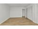 Spacious bedroom features wood-look laminate flooring and white closet doors, offering ample storage at 2718 Saint Thomas Dr, Punta Gorda, FL 33950