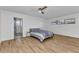 Spacious bedroom with wood flooring, ensuite bathroom access, and natural light offers a calming retreat at 2718 Saint Thomas Dr, Punta Gorda, FL 33950