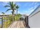 Relax on this private deck with a beautiful view of lush greenery, overlooking the canal and other nearby homes at 2718 Saint Thomas Dr, Punta Gorda, FL 33950
