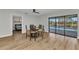 Bright dining area with a glass table, seating for four, and view of the pool at 2718 Saint Thomas Dr, Punta Gorda, FL 33950