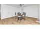 Simple dining area with modern decor and wood laminate flooring at 2718 Saint Thomas Dr, Punta Gorda, FL 33950