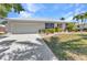Charming single-story home with a well-manicured lawn, beautiful landscaping, and a convenient two-car garage at 2718 Saint Thomas Dr, Punta Gorda, FL 33950