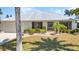 Charming single-story home with a well-manicured lawn, beautiful landscaping, and a convenient two-car garage at 2718 Saint Thomas Dr, Punta Gorda, FL 33950