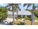 Charming home with lush palm trees, offering a serene and inviting curb appeal at 2718 Saint Thomas Dr, Punta Gorda, FL 33950
