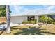 Charming single-story home with well-maintained landscaping and a two-car garage at 2718 Saint Thomas Dr, Punta Gorda, FL 33950