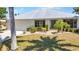 Well-manicured front yard featuring a bright single Gathering home at 2718 Saint Thomas Dr, Punta Gorda, FL 33950