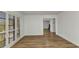 Bright living space featuring wood floors and large windows with plantation shutters, offering a clean design at 2718 Saint Thomas Dr, Punta Gorda, FL 33950
