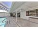 Enjoy a relaxing patio with a ceiling fan, and views of the backyard, pool, and the home's sliding glass doors at 2718 Saint Thomas Dr, Punta Gorda, FL 33950