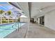 Enjoy a relaxing outdoor space in this inviting covered patio, right next to the pool, with patio furniture at 2718 Saint Thomas Dr, Punta Gorda, FL 33950