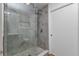 Modern tiled shower with glass door and built-in niche at 2718 Saint Thomas Dr, Punta Gorda, FL 33950