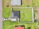 Aerial view of home showing large, fenced in yard, modern roof, and neighborhood layout at 3324 Port Charlotte Blvd, Port Charlotte, FL 33952