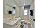 Stylish bathroom with modern vanity, marble countertop, gold fixtures, and a beautifully tiled walk-in shower at 3324 Port Charlotte Blvd, Port Charlotte, FL 33952