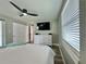 Well-lit bedroom with a ceiling fan, a large closet, modern decor, and a comfortable bed at 3324 Port Charlotte Blvd, Port Charlotte, FL 33952