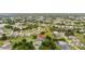 Expansive aerial view of a neighborhood with mature trees and well-maintained landscaping at 384 Viedma St, Punta Gorda, FL 33983