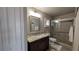 The bathroom features a vanity, glass shower, toilet, vanity mirror, and closet at 384 Viedma St, Punta Gorda, FL 33983