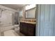 Well lit bathroom with a marble topped vanity, shower-tub combination, and tile flooring at 384 Viedma St, Punta Gorda, FL 33983