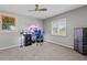 Bedroom featuring a ceiling fan, a desk and two monitors, with a single window and blinds at 384 Viedma St, Punta Gorda, FL 33983