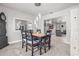 Dining room with a wooden table, chairs, and open access to the kitchen at 384 Viedma St, Punta Gorda, FL 33983