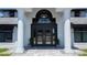 Home front entrance with pillars, black door and trim and brick paved entry at 384 Viedma St, Punta Gorda, FL 33983