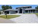 Stunning two-story home with a paver driveway and three-car garage at 384 Viedma St, Punta Gorda, FL 33983