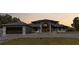 Grand home with a modern design, a dark grey roof, and a spacious three car garage at 384 Viedma St, Punta Gorda, FL 33983