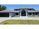 Beautiful two-story home with a striking entrance and well-manicured lawn at 384 Viedma St, Punta Gorda, FL 33983