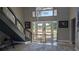 Welcoming foyer with modern staircase, glass front door, and stylish decor at 384 Viedma St, Punta Gorda, FL 33983