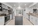 Modern kitchen boasts stainless appliances, granite counters, central island, and tile flooring at 384 Viedma St, Punta Gorda, FL 33983