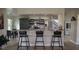 Modern kitchen with dark cabinets, granite countertops, island, and stainless steel appliances at 384 Viedma St, Punta Gorda, FL 33983
