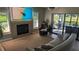 Well-lit living room features a fireplace, sliding doors, and neutral colored decor at 384 Viedma St, Punta Gorda, FL 33983