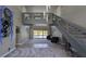 Spacious living room with high ceilings, grand staircase, and sliding glass doors to pool area at 384 Viedma St, Punta Gorda, FL 33983