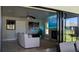 Living room with sliding glass doors leading to the patio and modern gray furnishings at 384 Viedma St, Punta Gorda, FL 33983