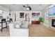 Bright living room with neutral tones, tile floors, modern furniture, and a ceiling fan at 384 Viedma St, Punta Gorda, FL 33983