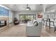 Cozy living room with a fireplace, large sliding glass doors, and comfortable neutral sofa at 384 Viedma St, Punta Gorda, FL 33983