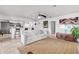 Open living space with tile flooring, modern furnishings, and a view of the kitchen area at 384 Viedma St, Punta Gorda, FL 33983