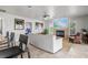 Open-concept living room features fireplace, ceiling fan, tile floors, and comfortable seating at 384 Viedma St, Punta Gorda, FL 33983