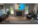 Comfortable living room features a fireplace, shuttered windows, and cozy seating at 384 Viedma St, Punta Gorda, FL 33983