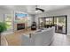 Bright living room with fireplace, sliding glass doors to the lanai, and comfortable seating at 384 Viedma St, Punta Gorda, FL 33983