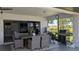 Spacious outdoor patio with dining and cooking spaces and a view of the backyard at 384 Viedma St, Punta Gorda, FL 33983