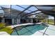 A screened-in pool and hot tub with a covered patio offering a relaxing outdoor living space at 384 Viedma St, Punta Gorda, FL 33983