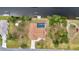 Perfect canal-front location of this home, seen from above with boat dock and pool at 4473 Sweetbay St, Port Charlotte, FL 33948