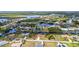 Panoramic aerial view of a waterfront community featuring houses along canals and lush surroundings at 4473 Sweetbay St, Port Charlotte, FL 33948