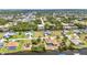 Expansive aerial view showcasing waterfront homes with canals and boat docks in a coastal community at 4473 Sweetbay St, Port Charlotte, FL 33948
